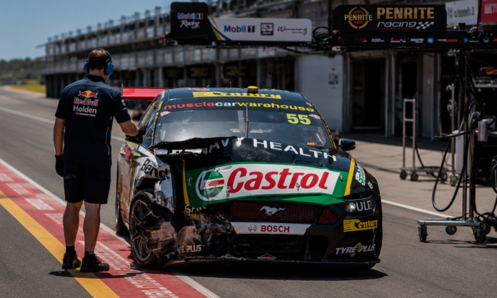 Damaged Ford Mustang Supercars Gen3 race car awaiting repairs after a Mount Panorama incident.